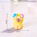Resin Capybara figurine with blue dolphin hat measuring 3.9cm high and 2.8cm wide - Pisces - Capybara