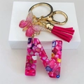 Detail of resin letter N keychain with pink glitter butterfly and soft silk tassel - Rose Red Butterfly Tassel Clip / Letter N