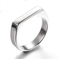 Detailed view of a polished stainless steel signet ring with a rectangular flat top - US 5 / Steel