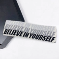 Beige knitted yoga headband featuring black Believe In Yourself lettering design - Black