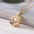 Elegante collana a fiori in oro e perle con pendente a farfalla in zircone colorato - Farfalla Fiore