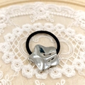 Minimalist silver star metal hair tie with black elastic band on lace background - Silver Star