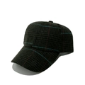 Detailed view of dark houndstooth pattern fabric on a classic structured baseball cap - Dark Grid with Blue and Red Lines (4)