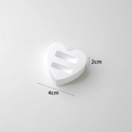 White heart-shaped gypsum ring display stand with dual slots for jewelry photography - Heart Double Slot Ring Holder