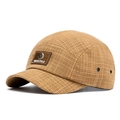 Short brim camp cap in camel plaid fabric with a square leather brand label - Brown