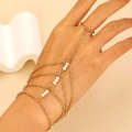 Gold multi-layer chain finger bracelet with white beads on minimalist beige background - Gold White Bead Style (8473)