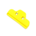 Bright yellow plastic food sealing clip with metal inserts on a white background - OPP Bag Yellow