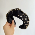 Detail of black knotted headband featuring sparkling rhinestones with gold metallic frames - Black