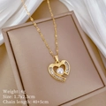 Macro shot of gold heart pendant with baguette zircons and pearl on a jewelry box - Gold Necklace (Titanium Steel Chain & Copper Pendant)