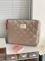 Close-up of pink and green checkered quilted cosmetic bag with green zipper and tassel - Handbag (Medium) / Green