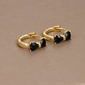 Close-up of 18K gold plated hoop earrings with black heart-shaped zircon bow details - Gold-Black