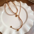 Detailed shot of double-layer suede necklace with 18K gold-plated tiger eye pendant - Necklace #29 - Brown (two-piece Set)
