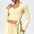 Detail of the pale yellow wrap yoga top with adjustable waist tie and soft brushed fabric - S / Tops / Light Yellow