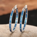 Chunky silver hoop earrings with sparkly deep blue inlay on natural stone base - Blue