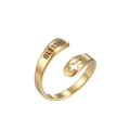 Close-up of golden adjustable ring featuring a cross cutout and Blessed engraving - Blessed Cross / Gold