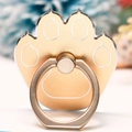 Detail of a golden cat-paw shaped metal phone ring holder with a frosted finish surface - Cat Paw Silver Border Gold