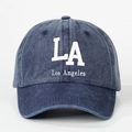 Navy blue washed denim baseball cap with white LA embroidery and Los Angeles text - One Size / Navy Blue
