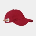 Detail of the side leather patch and metal rivet on a burgundy cotton baseball cap - Burgundy