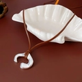 Minimalist silver abstract pendant necklace with brown leather cord on white shell tray - 79# Necklace-Coffee-Irregular