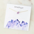 Amethyst gemstone chip necklace on a peaceful description card with golden chain - Amethyst
