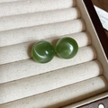 Close-up of vintage green round earrings displayed in a luxury beige cushioned jewelry box - 26# Silver Earring Post - Green Round Large Style
