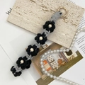 Handmade woven daisy flower keychain in grey and black yarn with white pearls - Dark Grey + Black