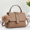 Brown leather handbag with litchi texture, gold buckle and decorative fur ball pendant - Apricot
