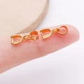 Golden copper pendant bail for jewelry DIY shown on fingertips for size scale - 6x15mm / Gold