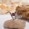 Detailed macro shot of a coiled silver snake ring featuring a round red garnet stone - Natural Garnet Retro Snake Ring LR391