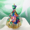 Resin wedding dress figurine filled with colorful crystals and gold flakes on a tray - Colored Shell Stone