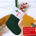 Forest green knit Christmas stocking featuring embroidered red letter T on white cuff - Letter T / Dark Green