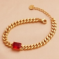 Elegant gold cuban chain bracelet featuring a large rectangular red zircon on champagne silk - 18K Gold / Red Zircon