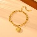 Detailed macro view of the gold stainless steel heart pendant and layered double chain design - Grid Double Heart Style (N709)