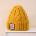 Close-up of cable knit texture and Lucky bear patch on bright yellow winter beanie - 3-8 Years / Yellow