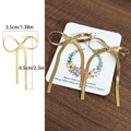 Elegantes pendientes de lazo de acero inoxidable chapados en oro 18K con borlas largas - Estilo Longitud 6.5cm / Dorado