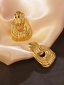 Vintage 80s style gold textured shell stud earrings on champagne silk fabric background - Gold Vintage Textured Studs
