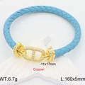 Bracciale in pelle intrecciata blu con fibbia in rame dorato e zirconi bianchi - Acqua
