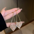 Detail of golden long earrings featuring crystal-encrusted heart pendants and chains - Pink Transparent Crystal Heart Drop (16# Silver Needle)