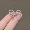 Silver bow brooch with sparkling crystals and teardrop pendants on female hand - 231# Gold Bowknot
