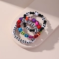 Three-piece set of vibrant skull-themed beaded bracelets in retro acrylic style - 3Pcs Colorful Skull