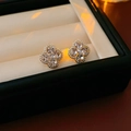 Elegant gold plated clover stud earrings set with sparkling crystals on a beige display - Gold Four-Leaf Clover Zircon Studs (65# Silver Earring Post)