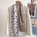 Pink silk skinny scarf with panda bamboo print styled on a beige blazer jacket - Panda Bamboo