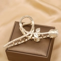 Elegant gold metal rose shaped hair claw clip displayed on a premium jewelry gift box - Gold Polished Rose-TZA13-29