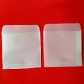 Detail of semi-transparent vellum envelopes with precise folded edges and flap closures - 6.5*10.5