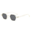 Modern hexagonal sunglasses with transparent frames and dark grey lenses in a side view - Transparent Frame Black Grey Lens