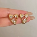 Elegant gold heart stud earrings featuring three sparkling zircon stones for women - Hollow Zircon Heart