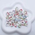 Macro view of ink-washed heart ceramic beads with colorful speckles for DIY jewelry - Colorful Terrazzo Spots