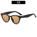 Stylish cat-eye sunglasses with glossy black frames and vibrant amber tinted lenses - Black Frame Tea Lens