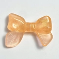 Orange luminous resin bow charm with golden glitter for DIY phone chains and keychains - 24x32mm / Orange