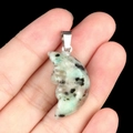 Face carved moon pendant in light green stone with black spots and silver clasp - Tianshan Blue